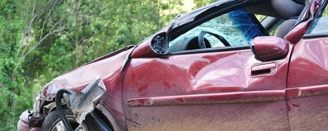 Red car that has been in an accident