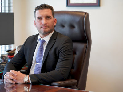Attorney Lyle Long sitting at his desk after being named a 2022 super lawyer rising star.