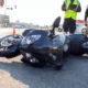 Black motorcycle on its side on the road after a motorcycle accident
