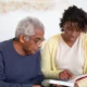 woman reading to nursing home resident in florida