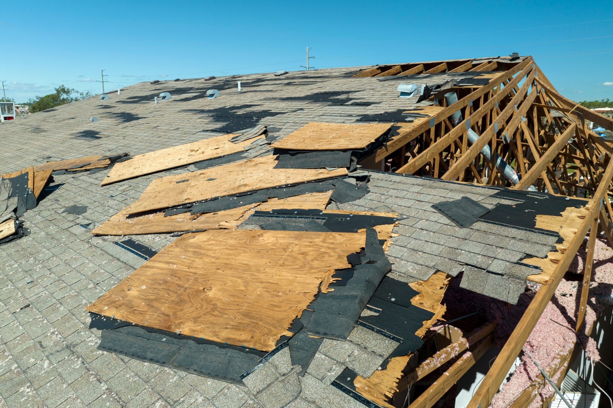 Wind damaged house roof.